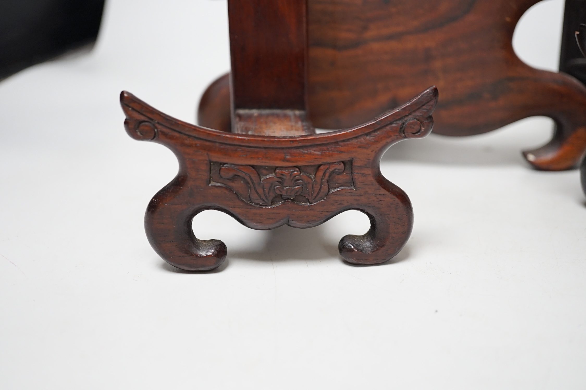 Four Chinese hardwood wood plate or dish stands, tallest 33cm